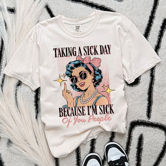 Taking A Sick Day Because I'm Sick Of You People DTF Heat Transfer, graphic t-shirt with a retro woman wearing sunglasses, pearls, and a pink headscarf, expressing a humorous message about taking a sick day from annoying people.