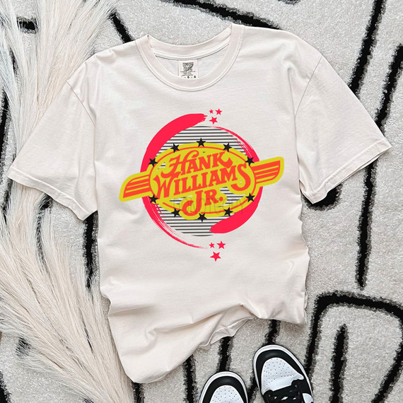 Hank Jr DTF Heat Transfer, graphic T-shirt with a vintage style design featuring yellow and red colors, stars, and bold text.