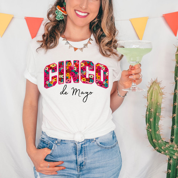 Cinco de Mayo Floral DTF Heat Transfer T-shirt, woman wearing a white T-shirt with colorful floral Cinco de Mayo design
