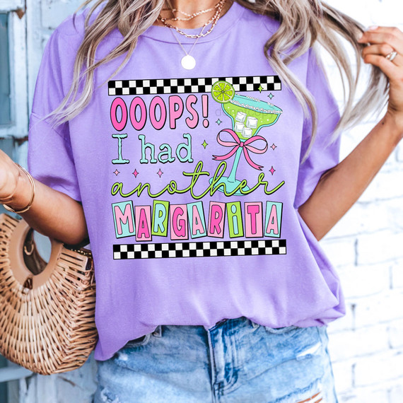 Ooops! I Had Another Margarita DTF Heat Transfer, colorful graphic T-shirt design featuring a margarita glass with a pink bow and lime garnish, for custom clothing and accessories.