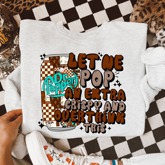 Let Me Pop An Extra Crispy And Overthink This, DTF Heat Transfer product, with colorful text and image of a Dr. Pepper can on a sweatshirt.