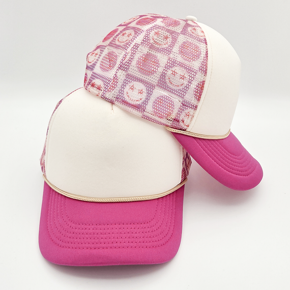 Happy Face Checkered Foam Trucker Hat, a stylish trucker cap with a pink brim and a checkered foam front featuring happy face patterns.
