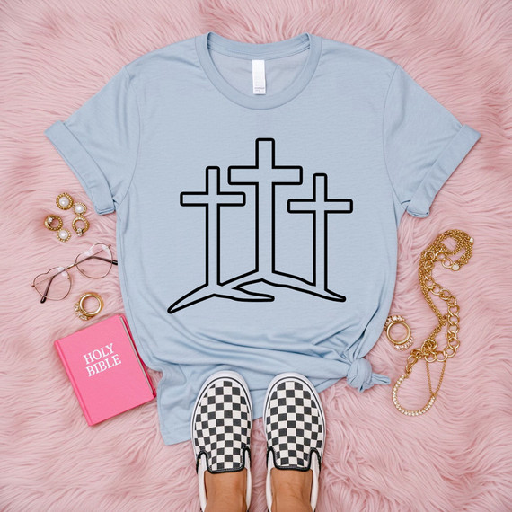 Three Crosses Outline DTF Heat Transfer, black outline design of three crosses on a light blue T-shirt.