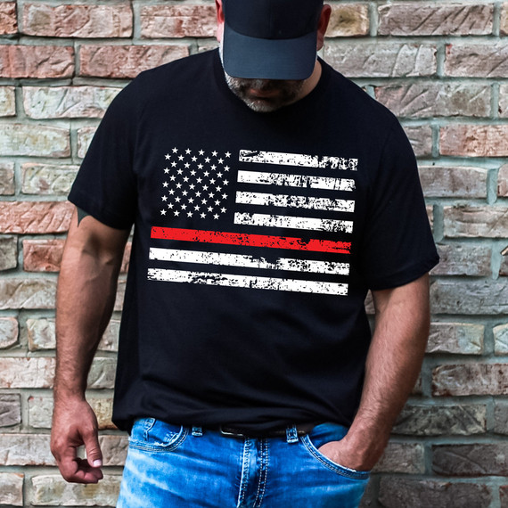 Thin Red Line Flag DTF Heat Transfer, black t-shirt featuring a distressed American flag design with a red line in the middle.