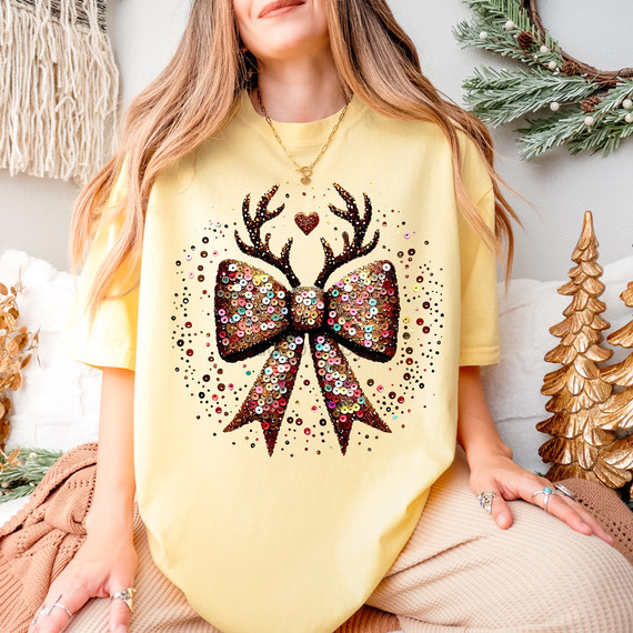 Faux Sequins Reindeer Bow DTF Heat Transfer, festive holiday design with sequin embellishments on a Christmas-themed t-shirt.