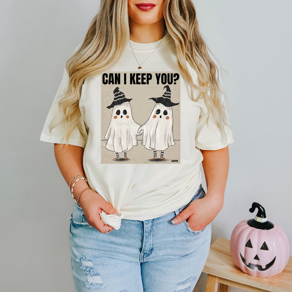 Can I Keep You? Ghost Couple DTF Heat Transfer, Halloween-themed ghost illustration wearing witch hats on a t-shirt worn by a woman.