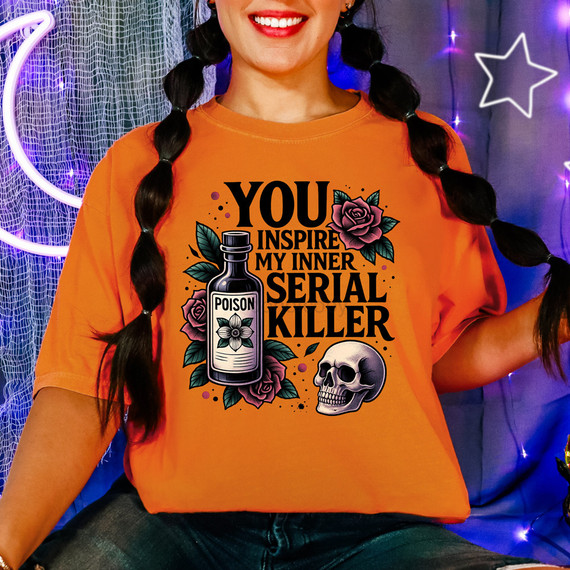 You Inspire My Inner Serial Killer DTF Heat Transfer, graphic design featuring a poison bottle, skull, roses, and text on an orange t-shirt.