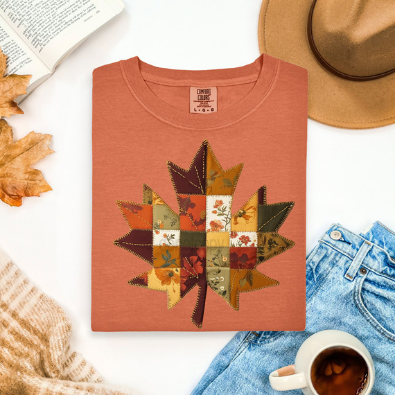 Patchwork Fall Leaf DTF Heat Transfer, pattern of a colorful patchwork autumn leaf on a salmon-colored T-shirt.