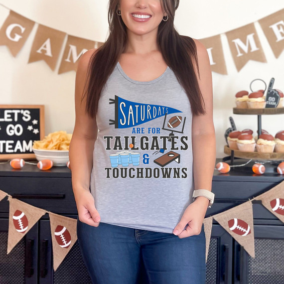 Blue Saturdays Are For Tailgates & Touchdowns DTF Heat Transfer, a woman wearing a gray tank top with a football and cups graphic for a tailgate party at a football-themed celebration.