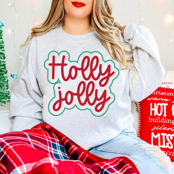 Holly Jolly Script DTF Heat Transfer, decorative red and green Christmas-themed text on a light gray sweatshirt.