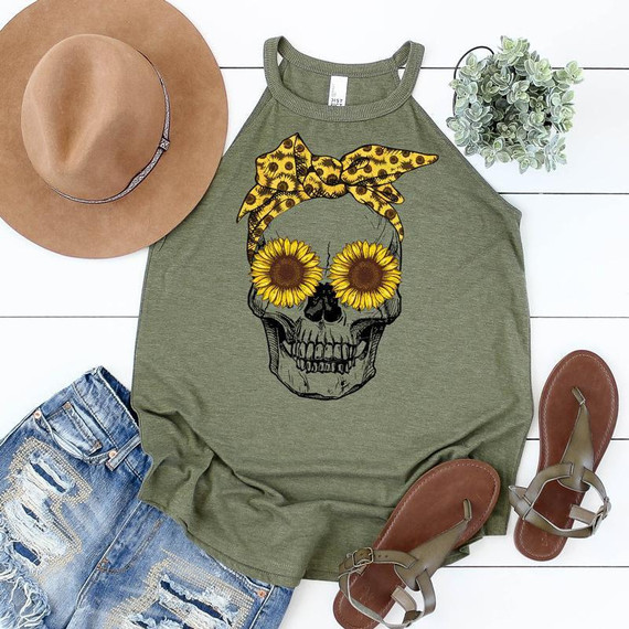 Sunflower Skull FINAL STOCK Screen Print Heat Transfer, clothing design featuring a skull with sunflower eyes and a yellow leopard print bow, styled with a tan hat, distressed denim shorts, and brown sandals.