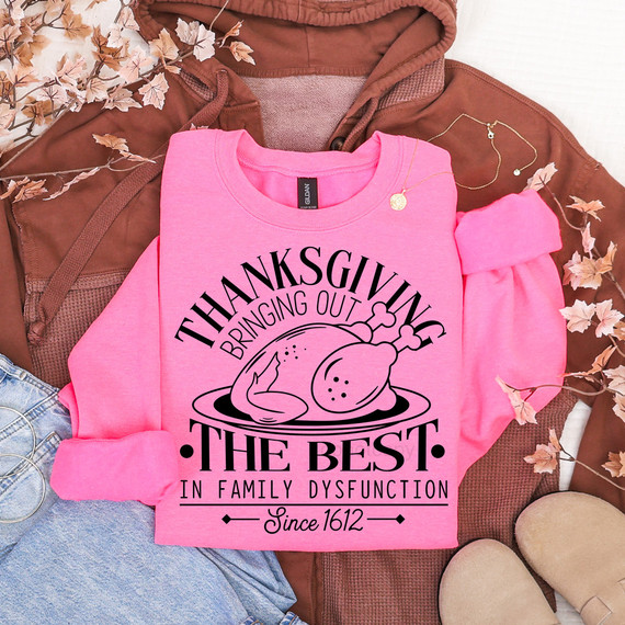 Thanksgiving Dysfunction DTF Heat Transfer, pink sweatshirt with fried chicken graphic and humorous Thanksgiving message.