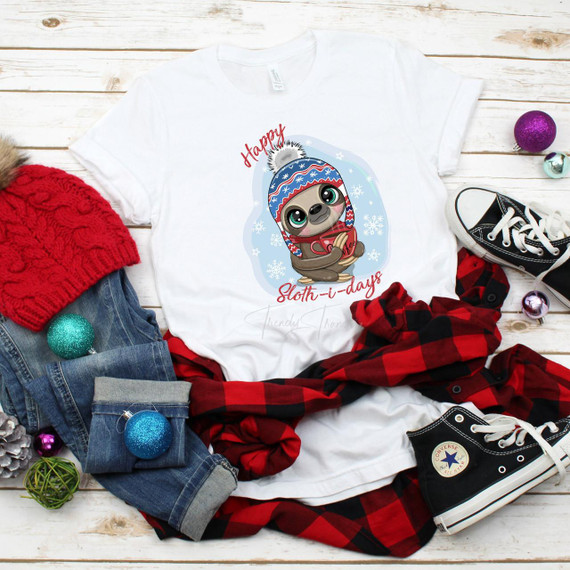 Happy Sloth-i-days Winter Sloth Sublimation Transfer, a cute sloth wearing a winter hat and holding a mug, on a white t-shirt surrounded by winter-themed decorations.
