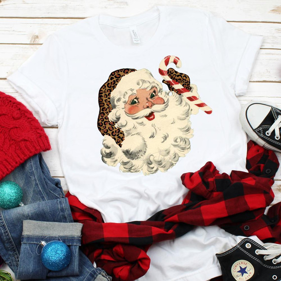 Vintage Leopard Santa Sublimation Transfer, Christmas-themed Santa Claus graphic with a leopard-print hat and candy cane on a white T-shirt.
