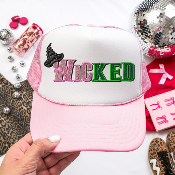 Wicked Faux Embroidery DTF Heat Transfer, pink and white trucker hat with embroidered witch hat and 'WICKED' text in pink and green, used for apparel decoration