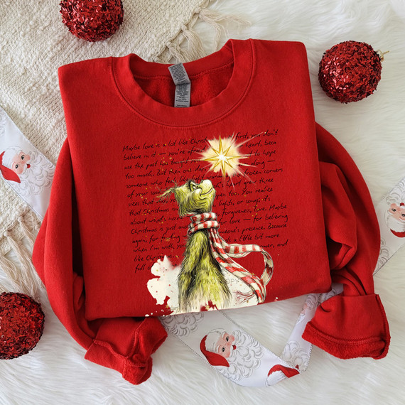 Green Guy Star DTF Heat Transfer, Christmas-themed sweatshirt featuring a green monster with a scarf and a star-shaped light at the top of its head.