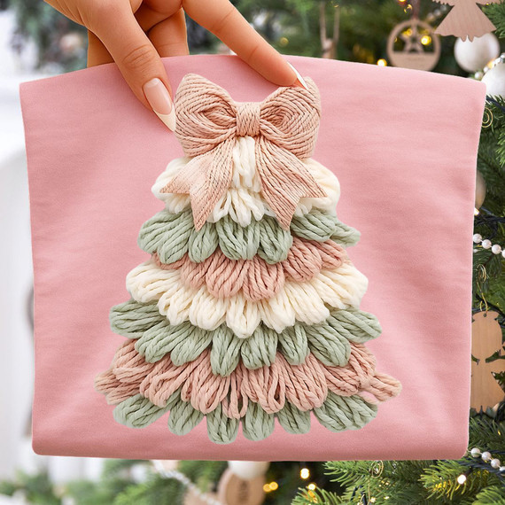 Faux Latch Hook Pastel Tree DTF Heat Transfer, handcrafted pastel-colored yarn latch hook Christmas tree decoration on pink gift box.