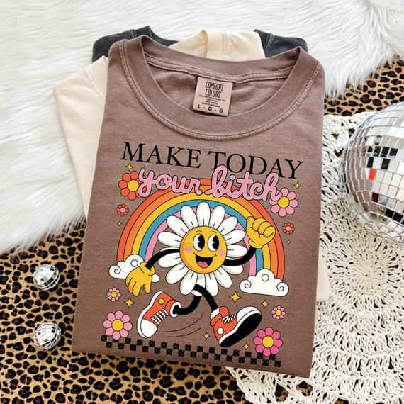 Retro Make Today Your Bitch DTF Heat Transfer, graphic design of a cheerful daisy character with a rainbow and flowers on a T-shirt.