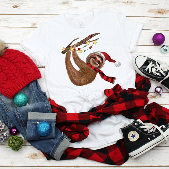 Christmas Winter Sloth Plaid Scarf Sublimation Transfer, festive illustration of a sloth wearing Christmas accessories holding a decorated stick, holiday-themed design on a white T-shirt