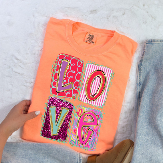 Faux Sequin Patchwork LOVE DTF Heat Transfer, colorful patchwork design on a peach-colored T-shirt.