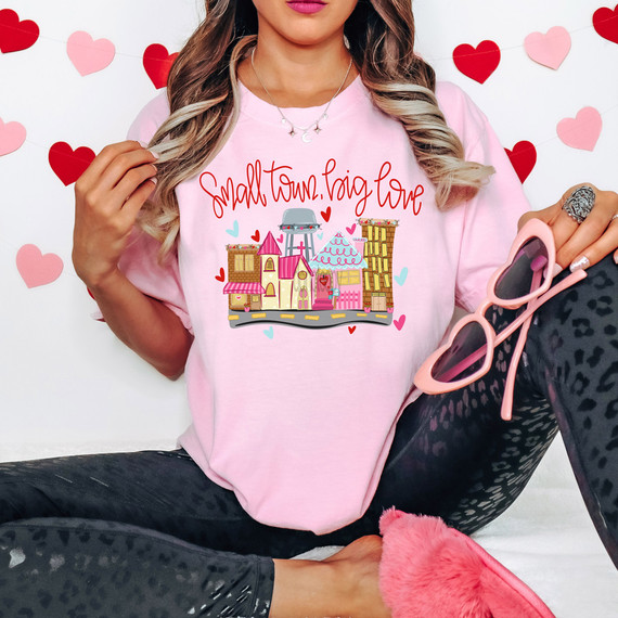 Small Town Big Love DTF Heat Transfer, pink T-shirt with colorful house and love-themed design.