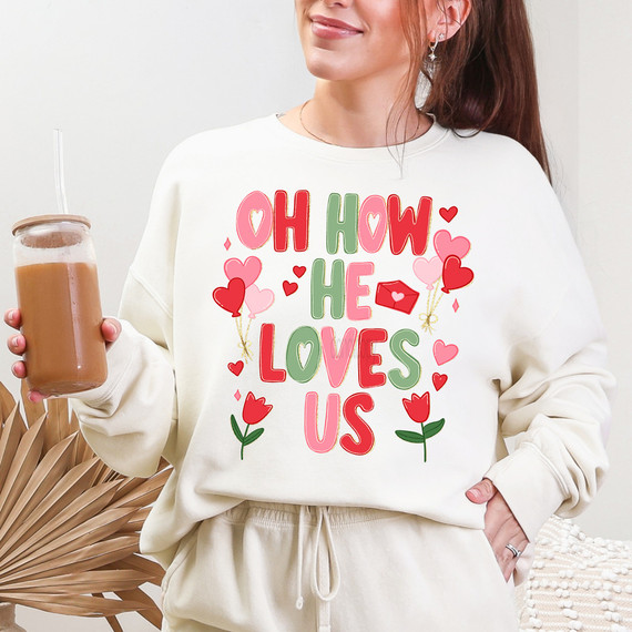 Soft Valentine Oh How He Loves Us DTF Heat Transfer, colorful design with hearts, flowers, and playful text on a white sweatshirt.