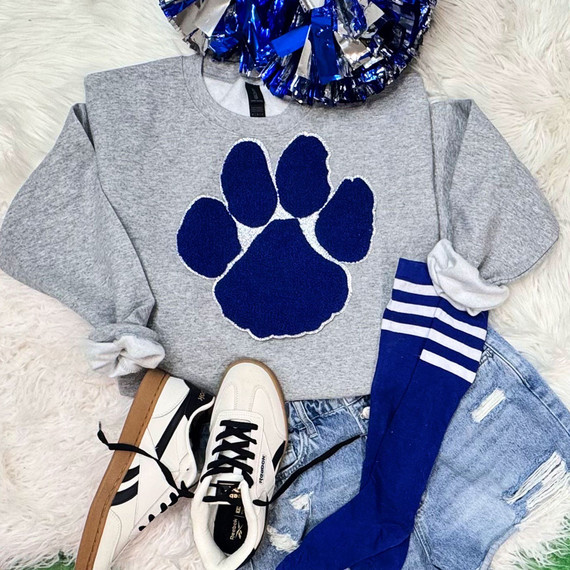 Royal Blue Silver Glitter Paw Patch, a blue glittery paw print patch on a gray sweatshirt.