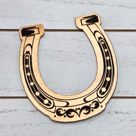Horseshoe FAUX Leather Patch, decorative faux leather patch shaped like a horseshoe with intricate black and gold designs for craft and clothing embellishments.