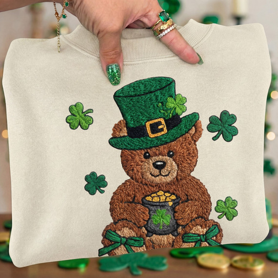 Faux Yarn St Patricks Day Bear DTF Heat Transfer, embroidered St. Patrick's Day bear holding a pot of gold with shamrocks and a green hat.