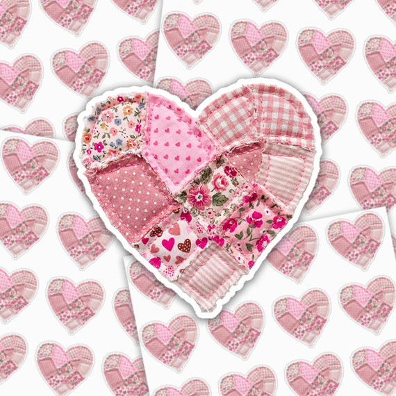 Patchwork Heart Sticker Sheet, a fabric sticker cutout shaped like a heart with pink patchwork quilt design including various pink and floral patterns.