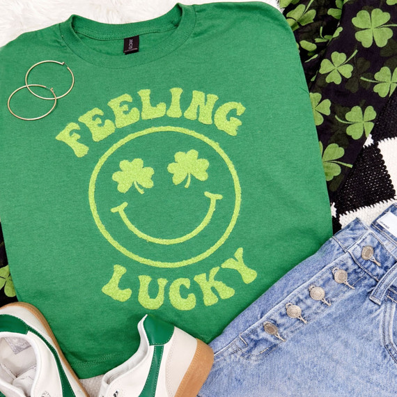 Feeling Lucky fluffy shamrock smiley patch with green textured lettering on a St. Patrick’s Day shirt