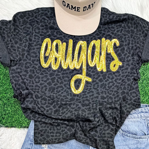 Cougars Gold Sequins Patch – School Spirit, black leopard print T-shirt with gold sequins 'Cougars' patch.