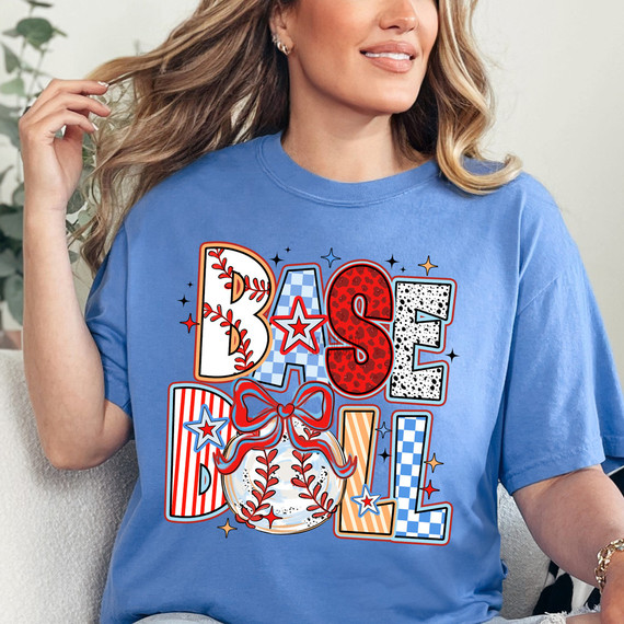 Retro Patterned Baseball DTF Heat Transfer, colorful and decorative design on a blue t-shirt featuring the word 'Baseball' with patriotic and sports-themed patterns.