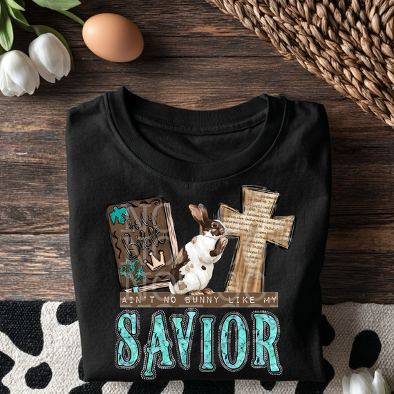 Ain't no bunny like my savior DTF heat transfer. Western faith based elements, turquoise lettering with a bible, cross, and bunny.