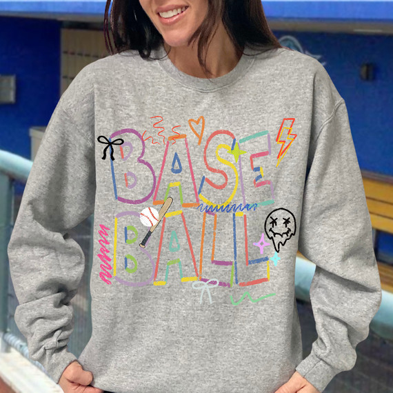 Crayon Baseball DTF Heat Transfer, colorful baseball-themed graphic design on a gray sweatshirt.
