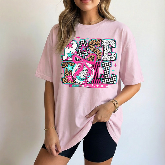 Mixed Pattern Baseball Bow DTF Heat Transfer, colorful and trendy design on a pink T-shirt.