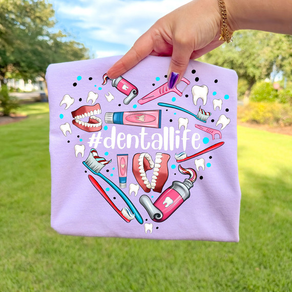 #dentallife WHITE DTF Heat Transfer, decorative print featuring dental tools, teeth, and mouth illustration on a purple fabric background.
