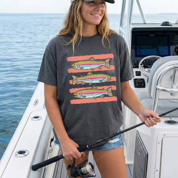 Trout Stripes DTF Heat Transfer, colorful fish design on a black T-shirt worn by a woman on a boat.