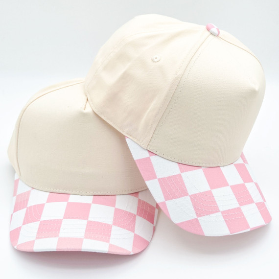 Cotton Checkered Blank Hats, image of two cream-colored cotton hats with pink and white checkered brims and a pink button on top.