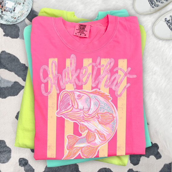 Shake That Bass DTF Heat Transfer, colorful T-shirt with a fish graphic and playful text design.