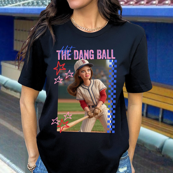 Hit The Dang Ball Doll DTF Heat Transfer, black T-shirt featuring a cartoon girl baseball player holding a bat, with colorful stars and text design.