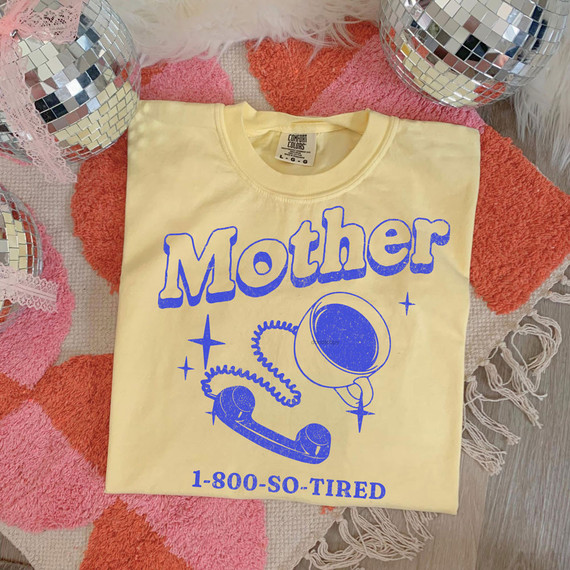 Mother 1-800-So-Tired DTF Heat Transfer, yellow T-shirt with blue graphic and text, featuring a vintage telephone and space-themed design.