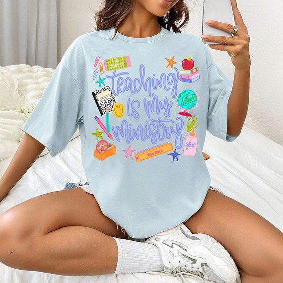 Teaching Is My Ministry DTF Heat Transfer, colorful graphic t-shirt with educational themed illustrations and motivational text.