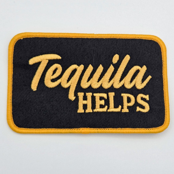 Tequila Helps Embroidered Hat Patch – Boutique Statement Patch for Hat Bars & Custom Collections, black and yellow embroidered patch with the text 'Tequila Helps' on a white background.