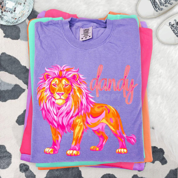 Dandy Lion DTF Heat Transfer, colorful lion graphic and 'dandy' text on purple t-shirt.