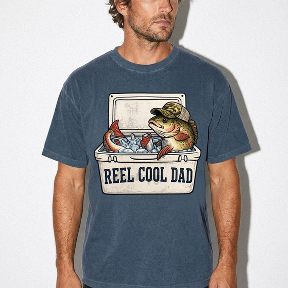 Reel Cool Dad Cooler DTF Heat Transfer, a graphic design featuring a fishing cooler with a fish wearing a camouflage hat on a blue T-shirt.