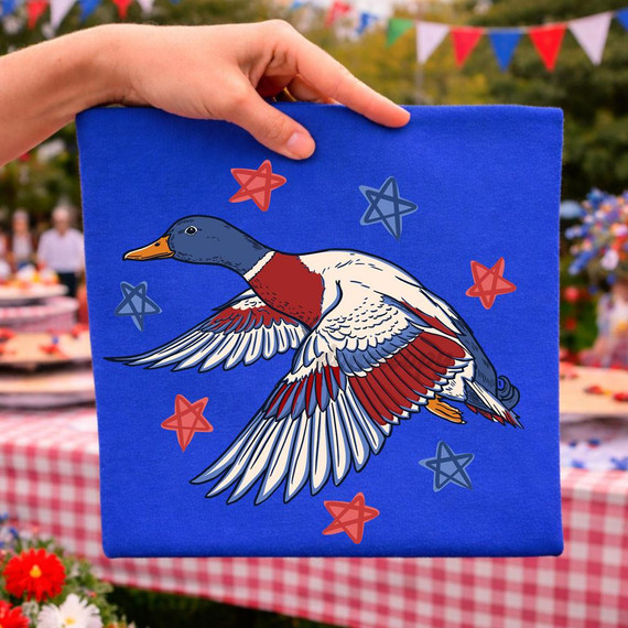 Patriotic Flying Duck DTF Heat Transfer, colorful flying duck design on a blue background with red and blue stars for patriotic themed crafts.