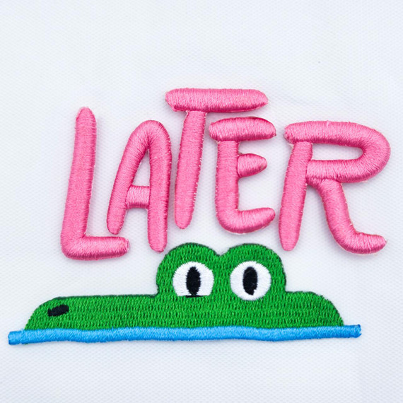 Later Gator Puff Embroidered Hat Patch – 4 x 3 inches, pink embroidered word 'LATER' with a green crocodile patch below on white fabric background.