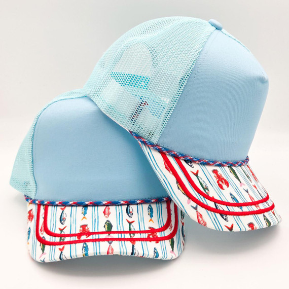Coastal Fishing Print Blank Trucker Hat, light blue mesh and fabric cap with colorful fishing boat pattern on the brim.