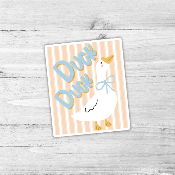Tan Stripe Duck Duck Goose Die Cut Vinyl Sticker, featuring a white goose with a yellow beak and feet, wearing a light blue bow, with the phrase 'Duck Duck Goose' in blue letters on an orange and white striped background.